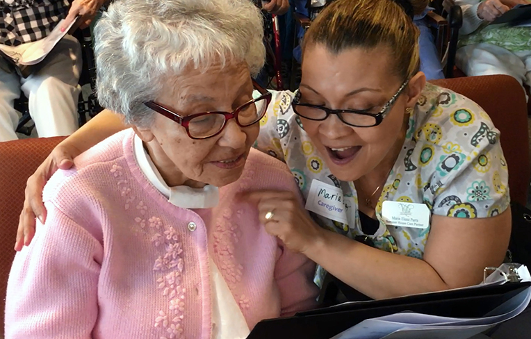 memory care resident and caregiver staff